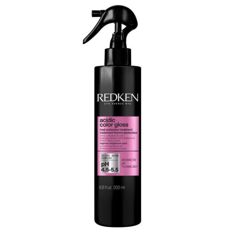 Redken acidic color gloss bottle with pink label on a white background