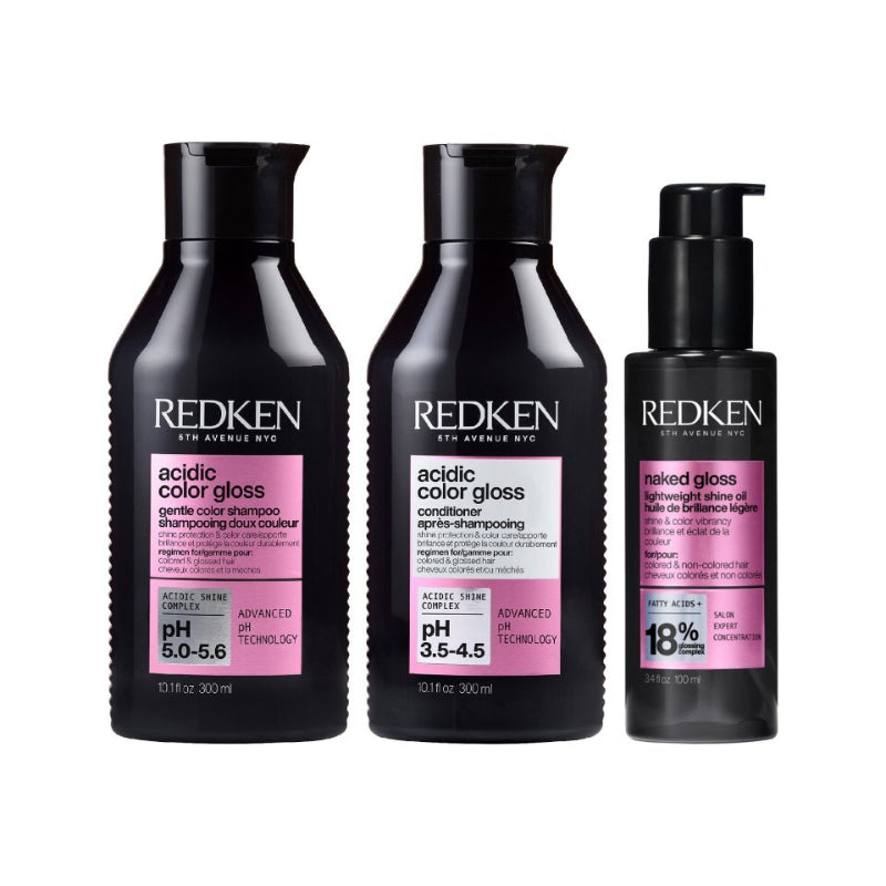 Redken hair care products including shampoo, conditioner, and serum on a white background