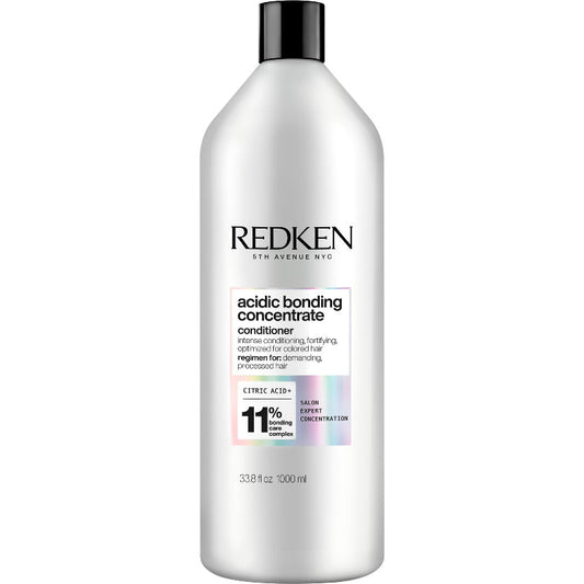 Redken acidic bonding concentrate conditioner bottle on a white background